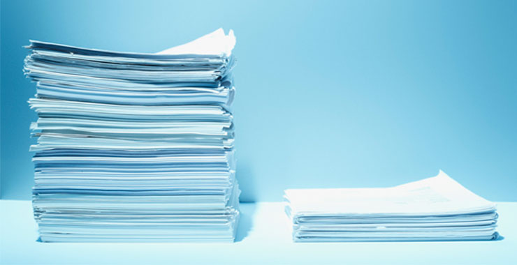Tall and short stacks of paper with blue background